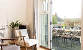 Open the doors from the kitchen/dining-room onto the terrace to bring the outside in. - Thumbnail Image