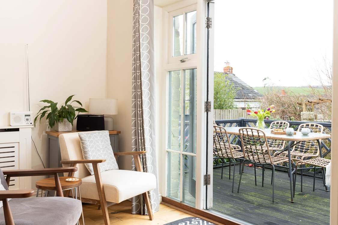 Open the doors from the kitchen/dining-room onto the terrace to bring the outside in.