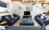 The sitting-room is a wonderfully sociable space with comfy sofas for everyone. - Thumbnail Image