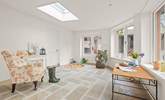 The conservatory is a light and airy space, perfect for enjoying a good book. It also opens up out into the courtyard, which is currently in its final finishing stages. - Thumbnail Image