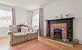 The coal-effect fire gives off a fabulous glow, making the sitting-room the perfect place to snuggle up in whilst watching a good film. - Thumbnail Image