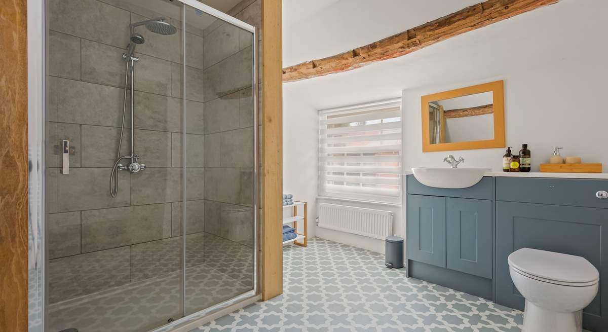 Down a few steps from bedroom one you will find its fabulous en suite shower-room.