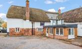 Looking back at Bridge House from the courtyard outbuildings and parking area. - Thumbnail Image