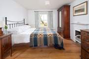 En suite bedroom with king-size bed and stunning views.