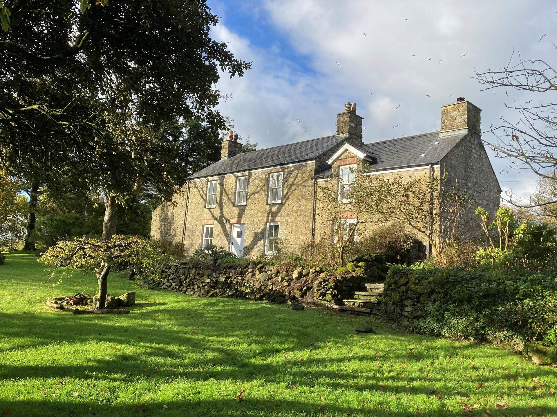 Set in an idyllic location, spend time in the sunshine on the spacious lawns which surround the farmhouse.