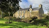 Set in an idyllic location, spend time in the sunshine on the spacious lawns which surround the farmhouse.