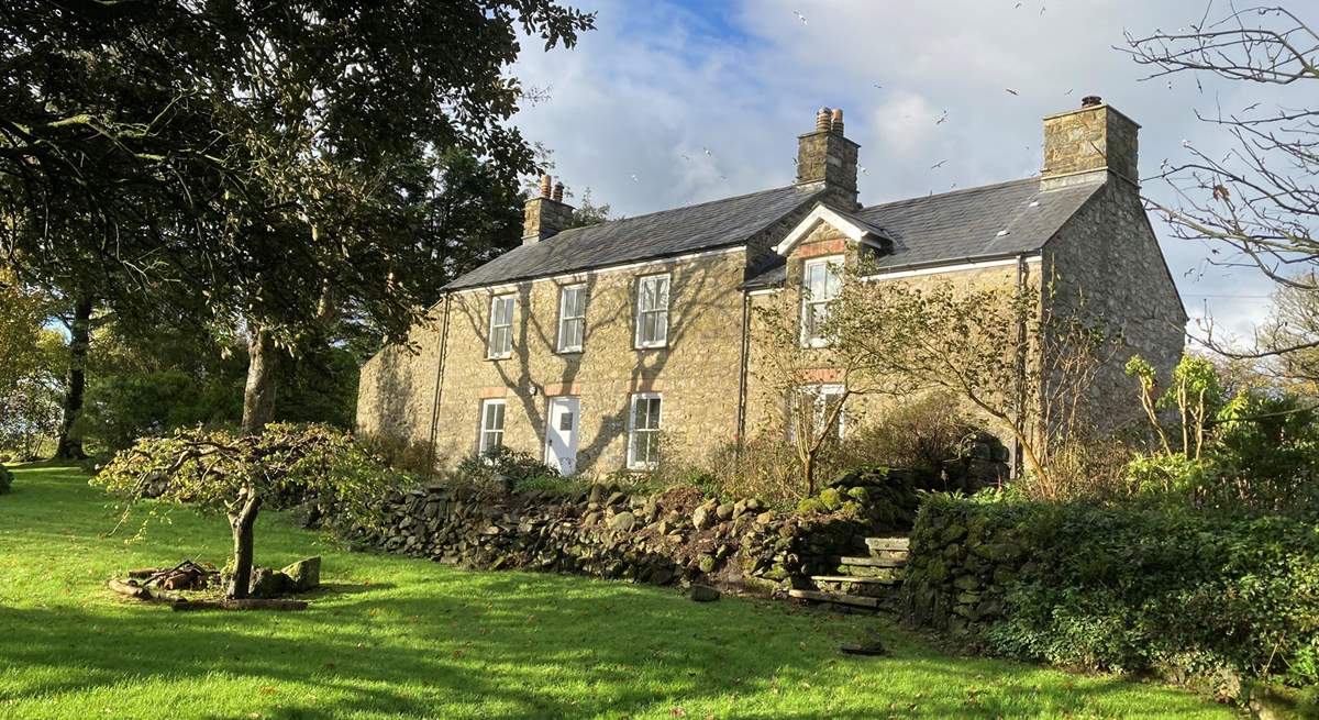 Set in an idyllic location, spend time in the sunshine on the spacious lawns which surround the farmhouse.