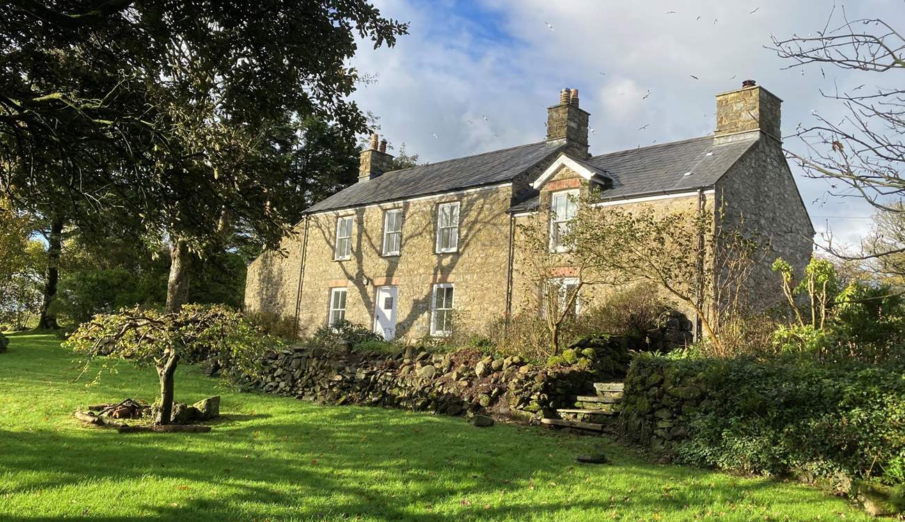Set in an idyllic location, spend time in the sunshine on the spacious lawns which surround the farmhouse.