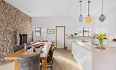 The kitchen and dining space has crisp, clean lines.  - Thumbnail Image