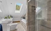 The main bedroom benefits from a rather lovely en suite, enjoying both a bath and shower. Take care around the sloping ceilings.  - Thumbnail Image