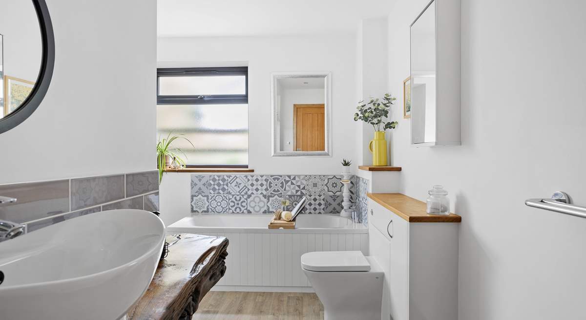 The sumptuous family bathroom sits between bedroom 2 and 3.