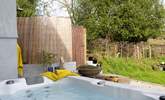 Just outside the snug you will discover the four person hot tub, perfectly positioned for privacy from the rest of the house and to take in the views.  - Thumbnail Image