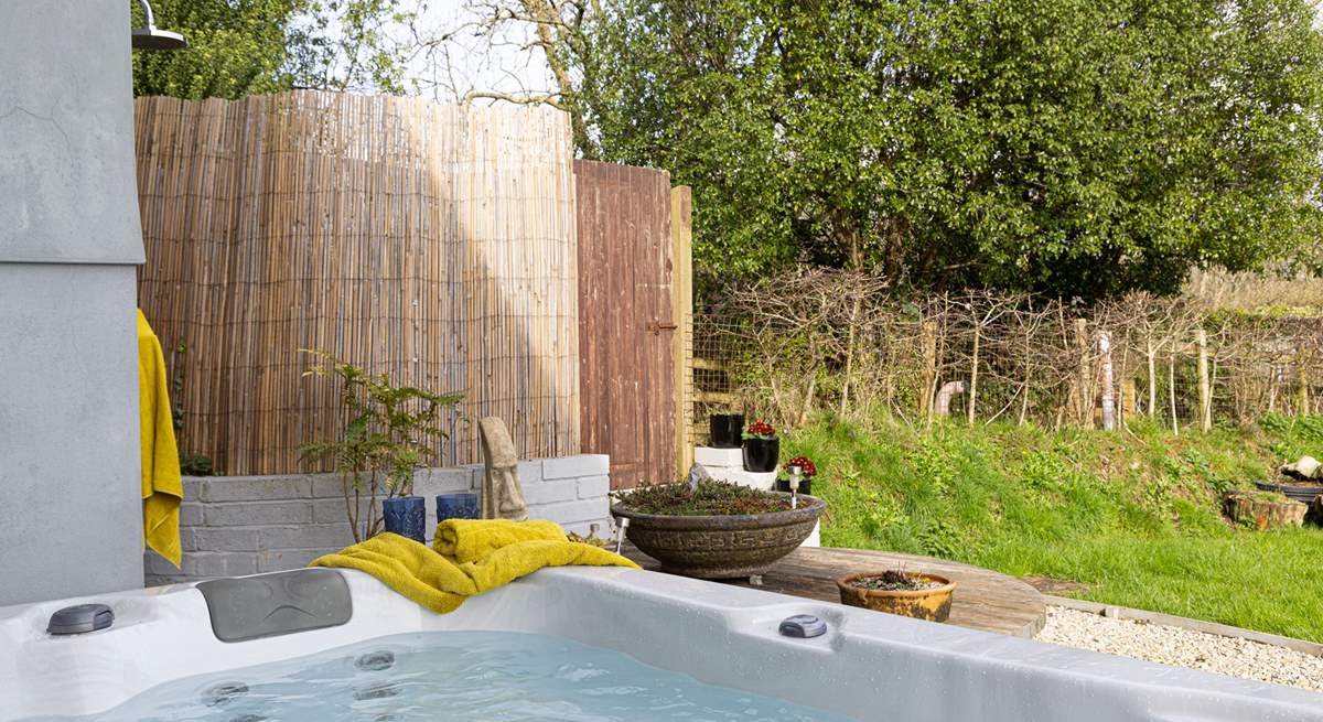 Just outside the snug you will discover the four person hot tub, perfectly positioned for privacy from the rest of the house and to take in the views. 