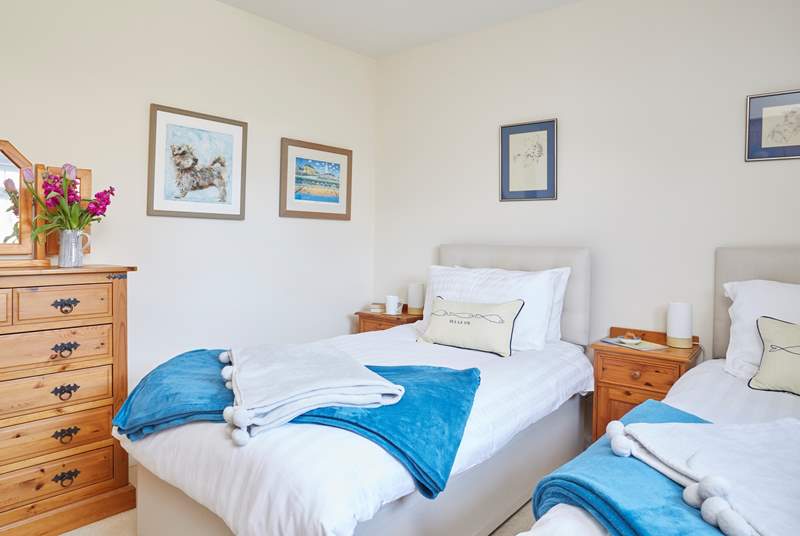 The inviting twin bedroom with views out to the grounds, listen out for the sounds of the country all around.