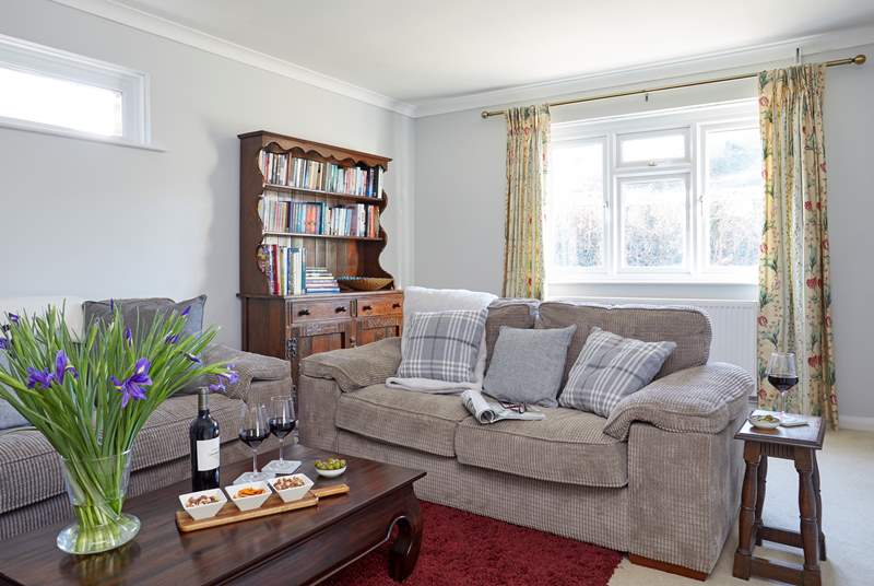 Wine and nibbles in the comfortable sitting-room.