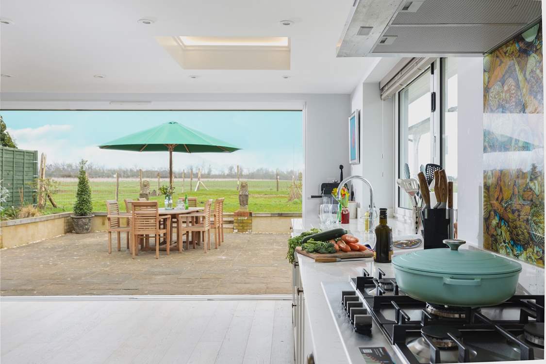 The stylish open plan living-room opens up fully onto the al fresco dining terrace.