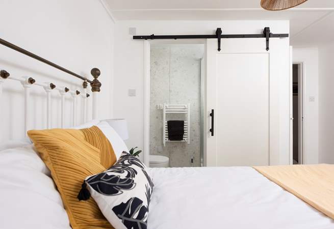 The sliding door to a sweet en suite shower-room in bedroom 3.