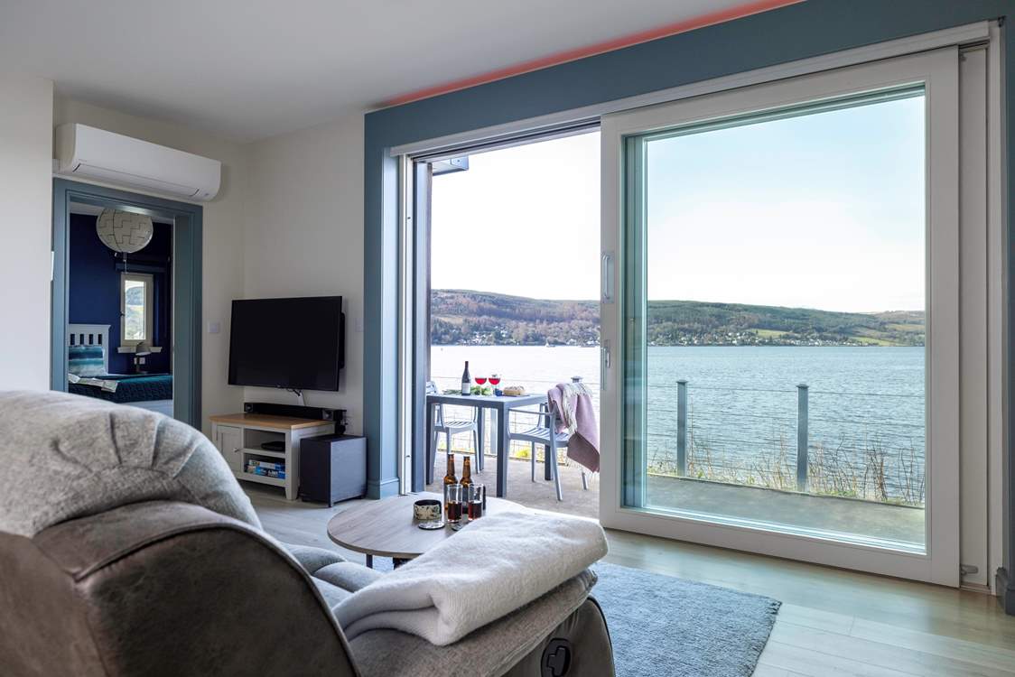 Watch life on the water through the sliding doors.