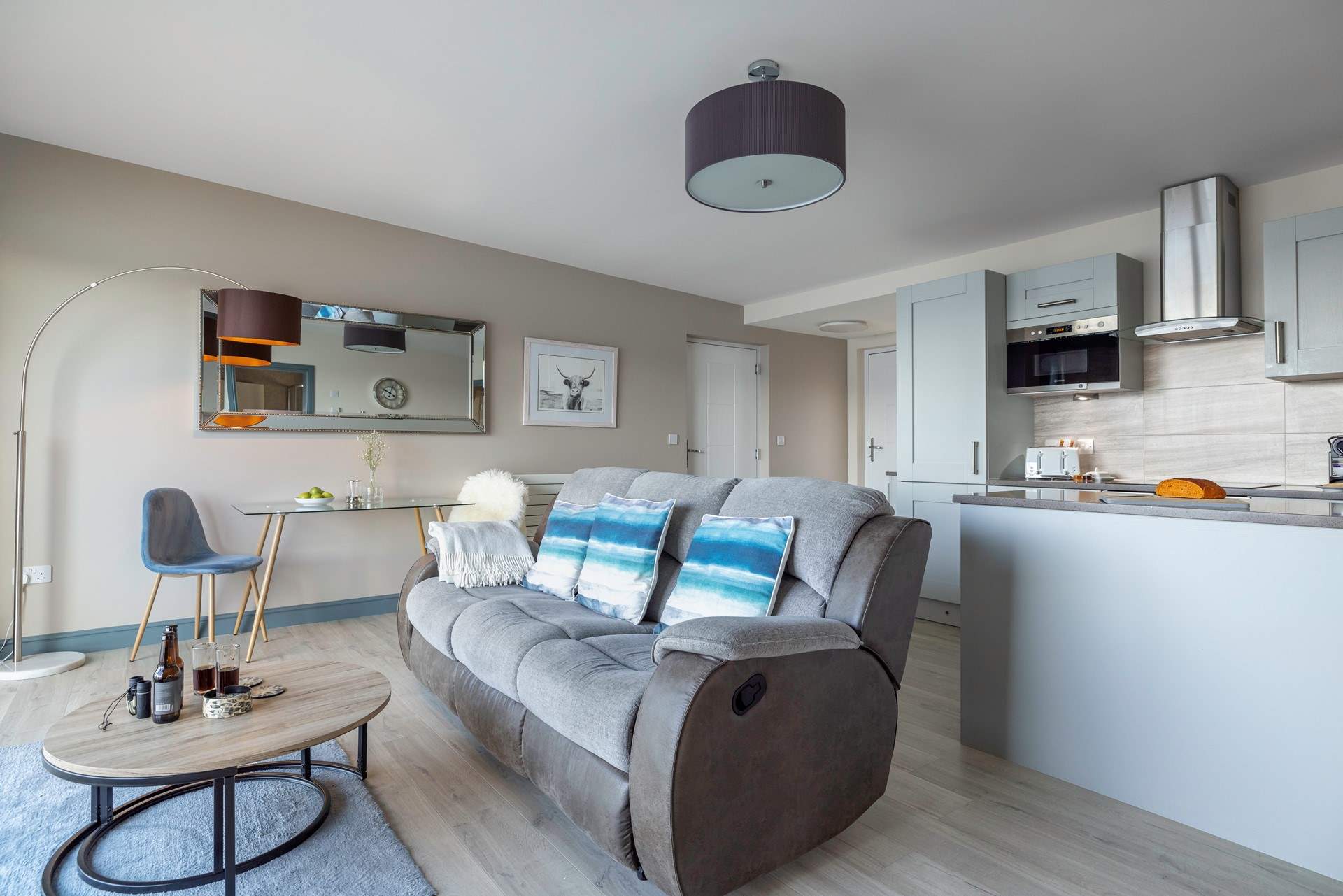 The contemporary open plan living area is ideal for simply sitting and watching.