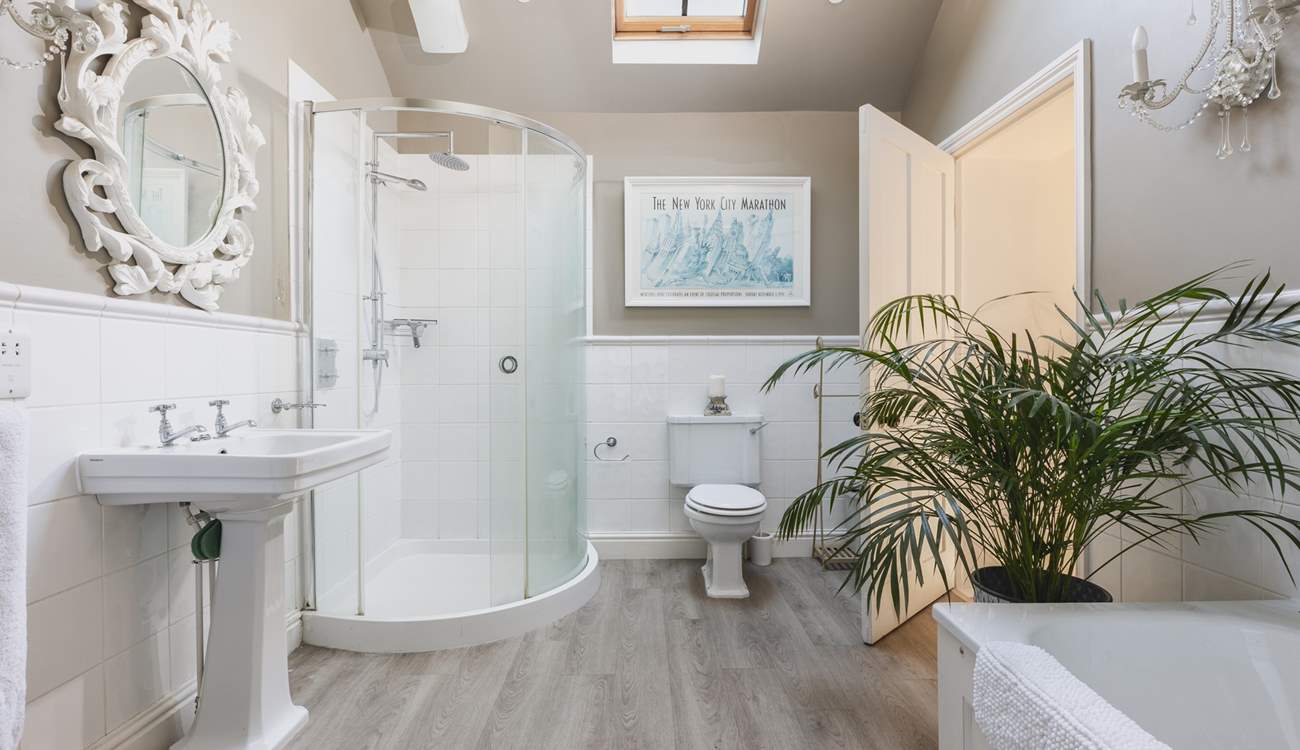 The gorgeous family bathroom has both a bath and a shower cubicle. 