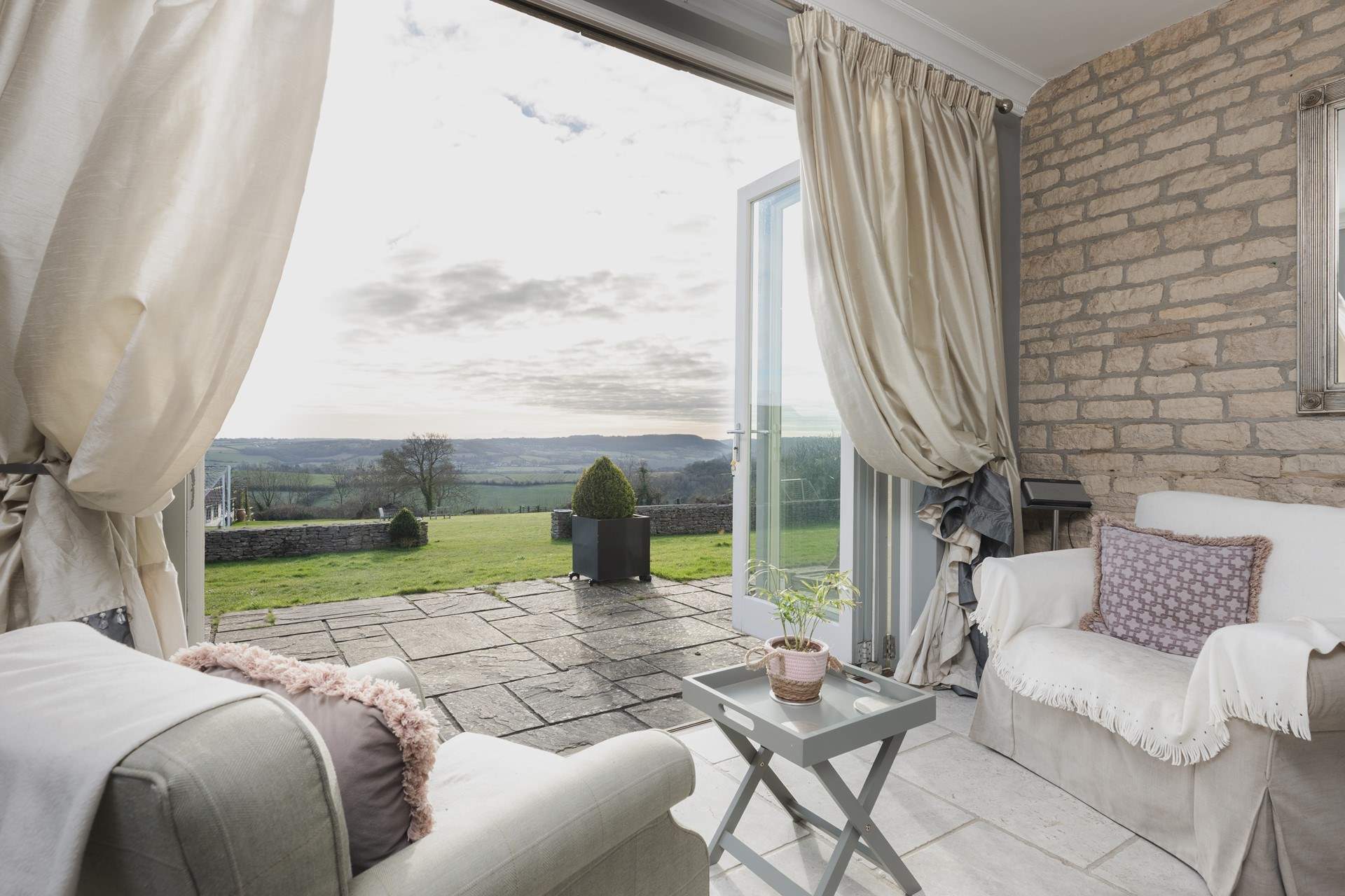 French doors open out onto the patio and extensive gardens. 