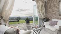 French doors open out onto the patio and extensive gardens. 