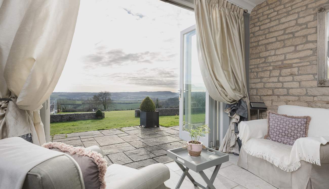 French doors open out onto the patio and extensive gardens. 