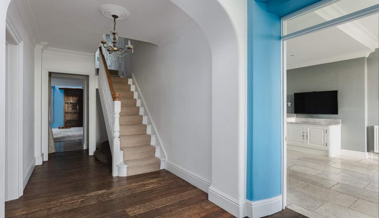 Climb the stairs to the four charming bedrooms on the first floor. 