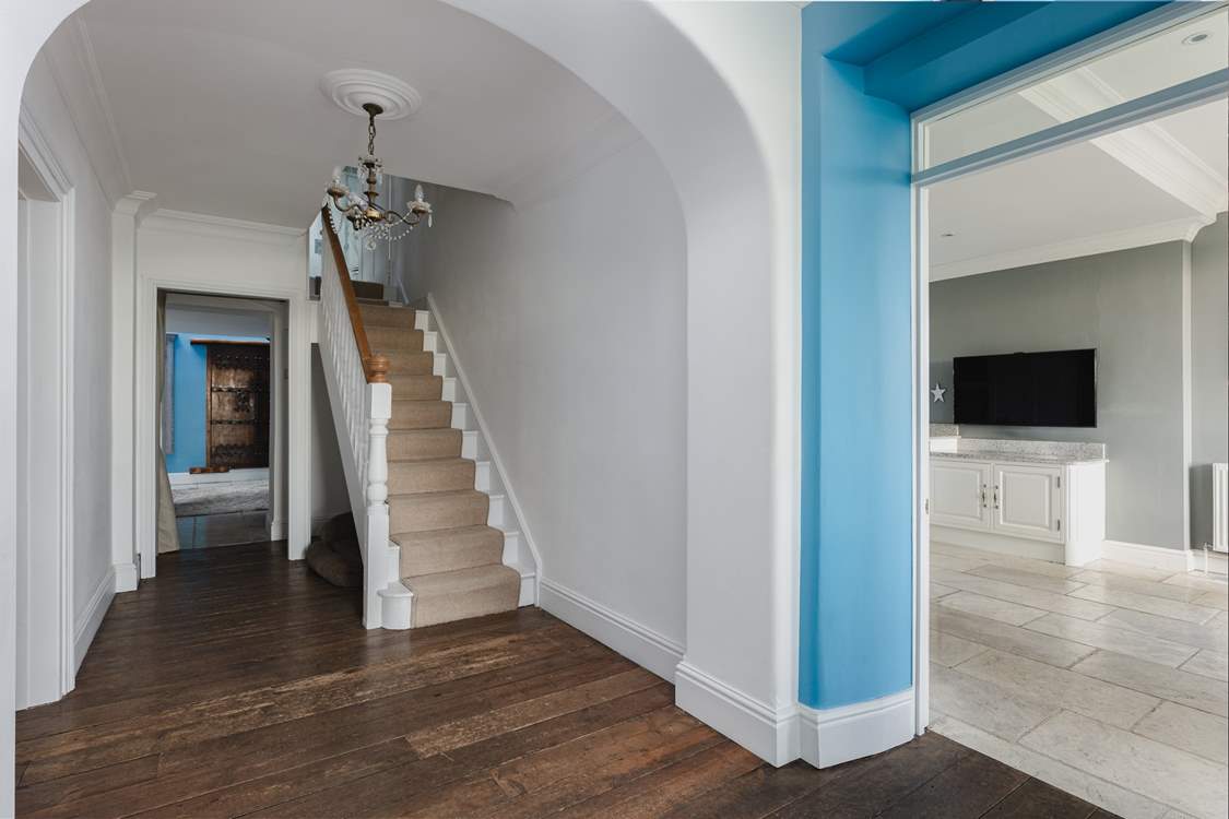 Climb the stairs to the four charming bedrooms on the first floor.