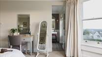 This delightful bedroom has a convenient en suite shower-room. 