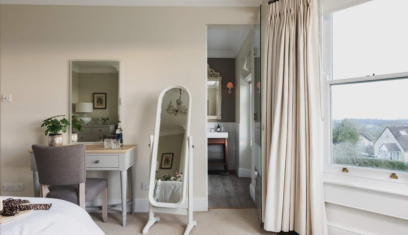 This delightful bedroom has a convenient en suite shower-room. 