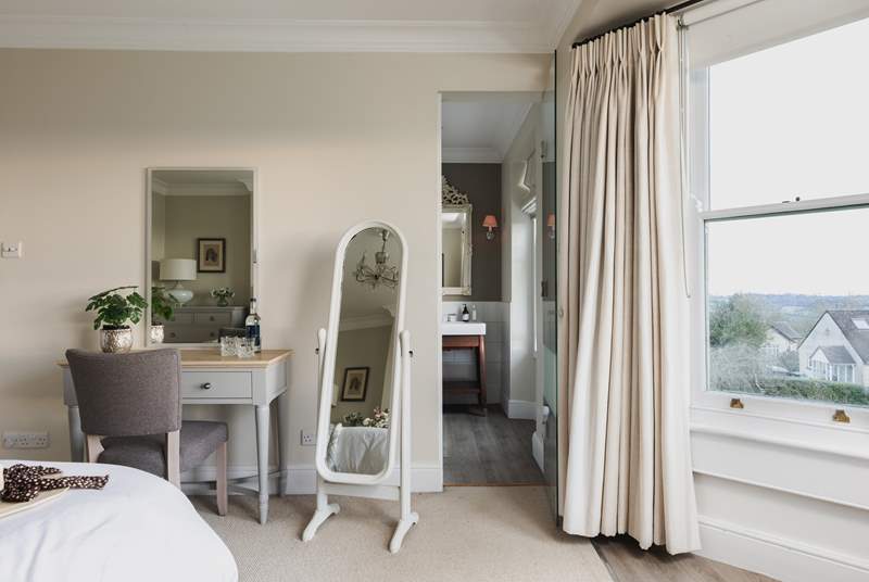 This delightful bedroom has a convenient en suite shower-room. 