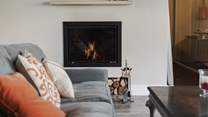 Snuggle up in front of the wood-burner after a busy day exploring. 