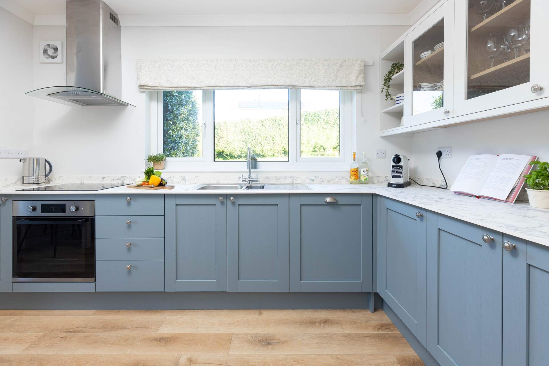 The stylish kitchen/diner with the table located on the left-hand side. 