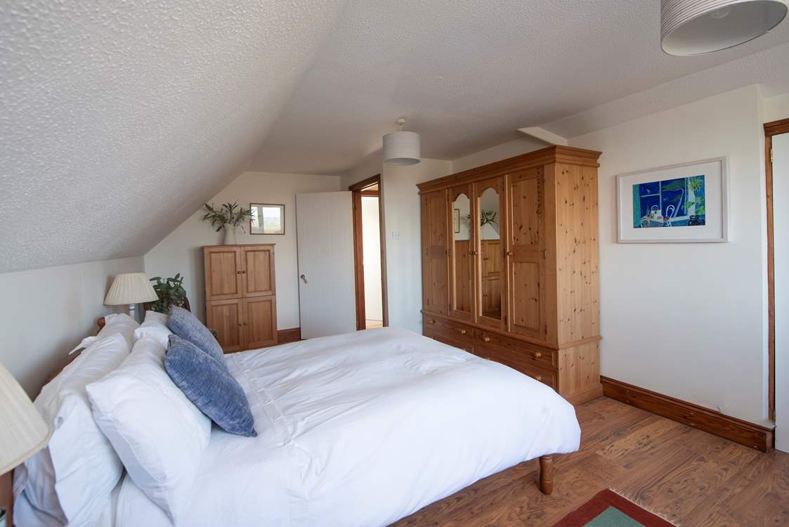 Bedroom 1 has lovely furnishings and bed linens.