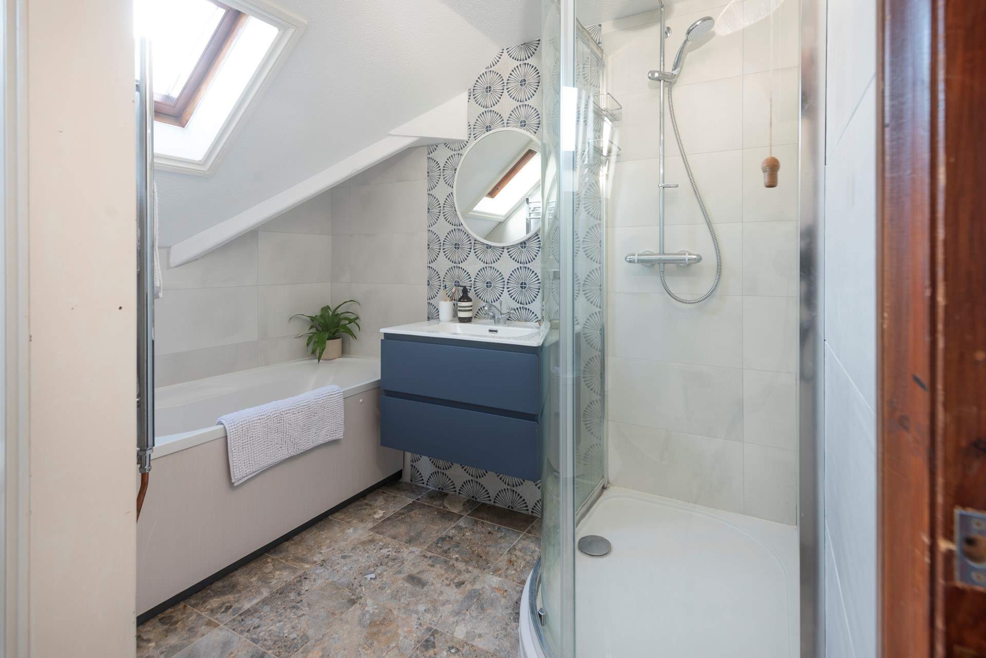 The contemporary family bathroom located on the first floor. 