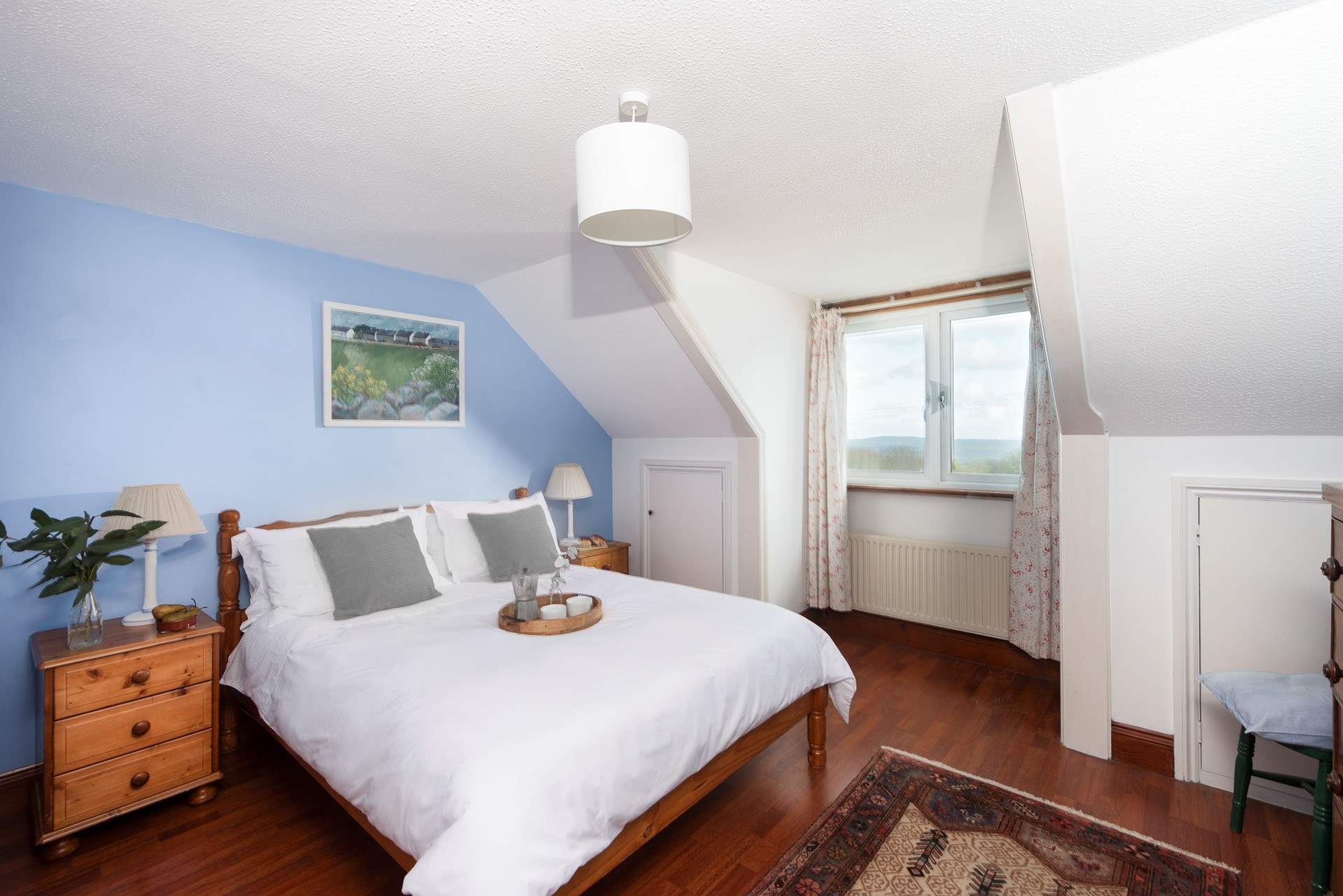 Bedroom 3 is a spacious double room. We suggest bringing along a pair of slippers for the wooden floors throughout the house. 