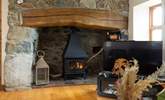 Enjoy the cosy glow from the gas stove, Plas Hufen is an ideal cottage for all seasons.  - Thumbnail Image