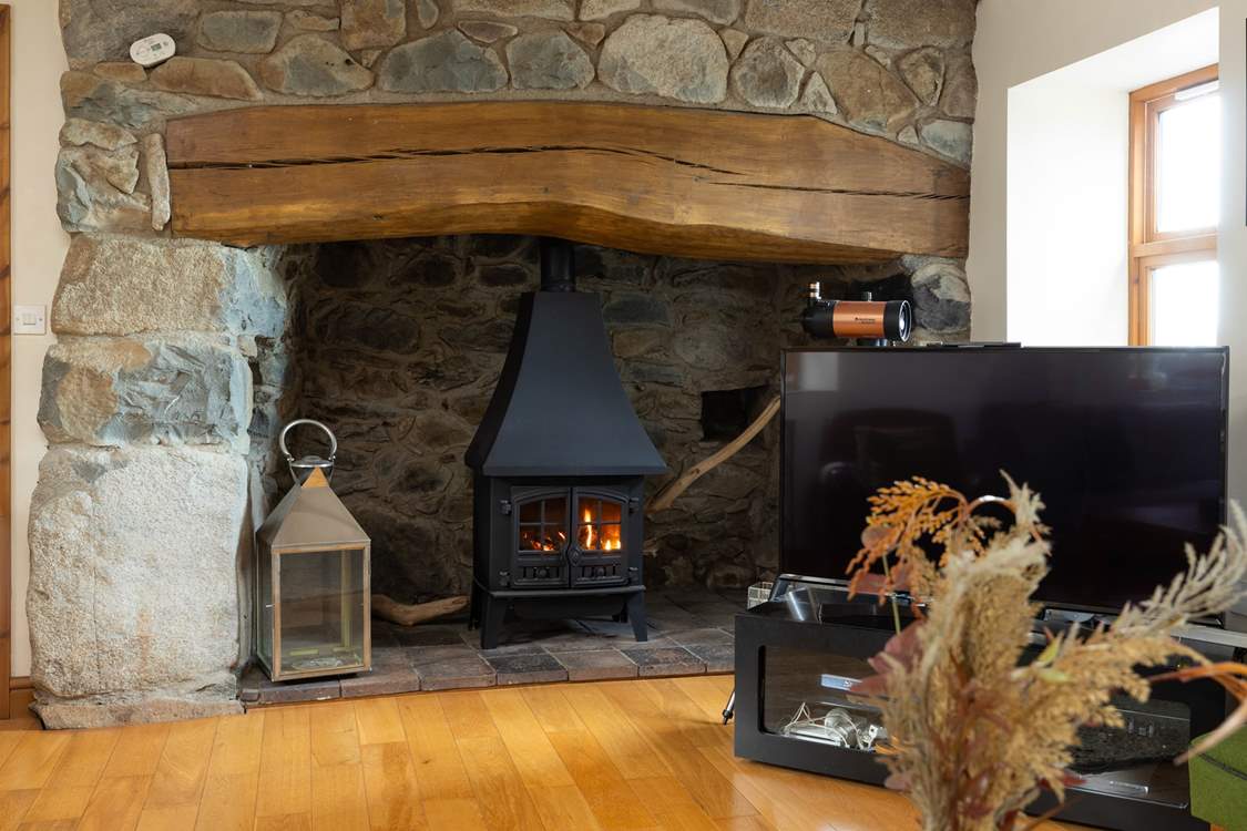 Enjoy the cosy glow from the gas stove, Plas Hufen is an ideal cottage for all seasons.