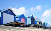 Pretty beach huts and golden sand at Abersoch.  - Thumbnail Image