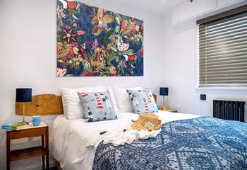 Three colourful bedrooms await at this coastal retreat.