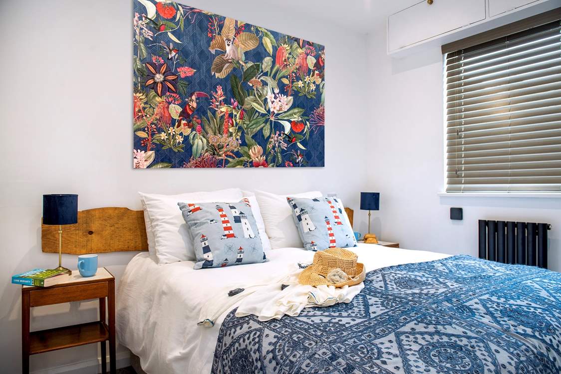 Three colourful bedrooms await at this coastal retreat.