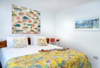 Fresh and bright decor in bedroom one.
