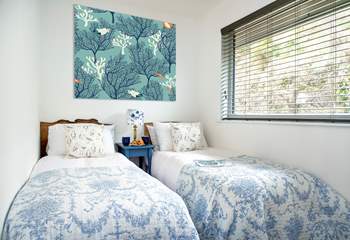 The twin-bedded room sits at the back of the lodge.