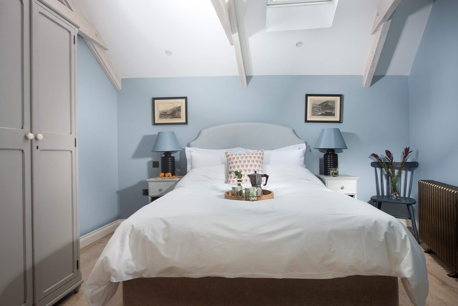 Both beds are dressed in luxurious linens.