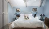 Both beds are dressed in luxurious linens. - Thumbnail Image