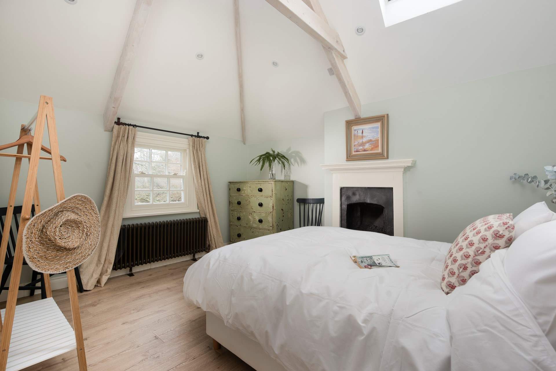 The vaulted ceiling and exposed beams add to the overall romance and charm.