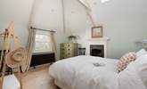 The vaulted ceiling and exposed beams add to the overall romance and charm. - Thumbnail Image