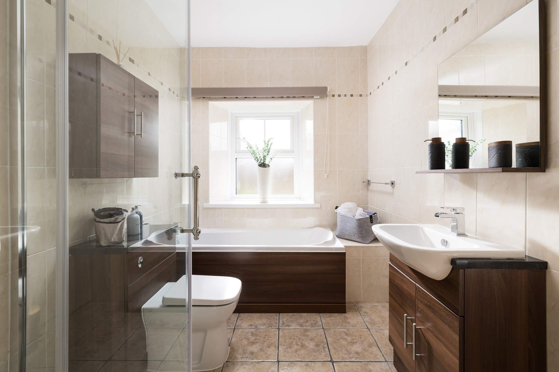 The bathroom has a separate shower and bath to soothe away any aches and pains.