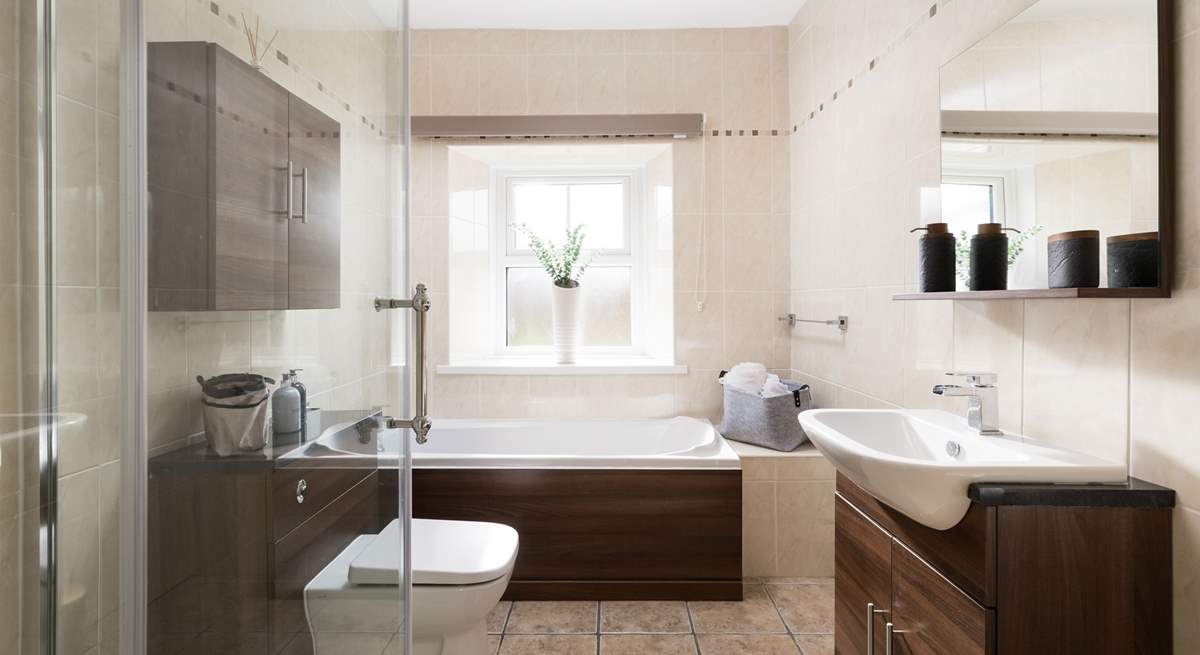 The bathroom has a separate shower and bath to soothe away any aches and pains.